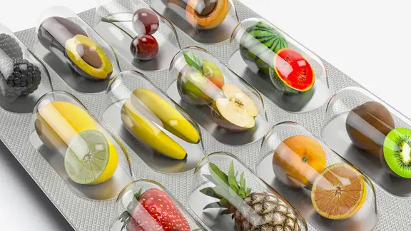 Illustration von verschiedenen Früchten, die in einer Blister-Verpackung stecken.