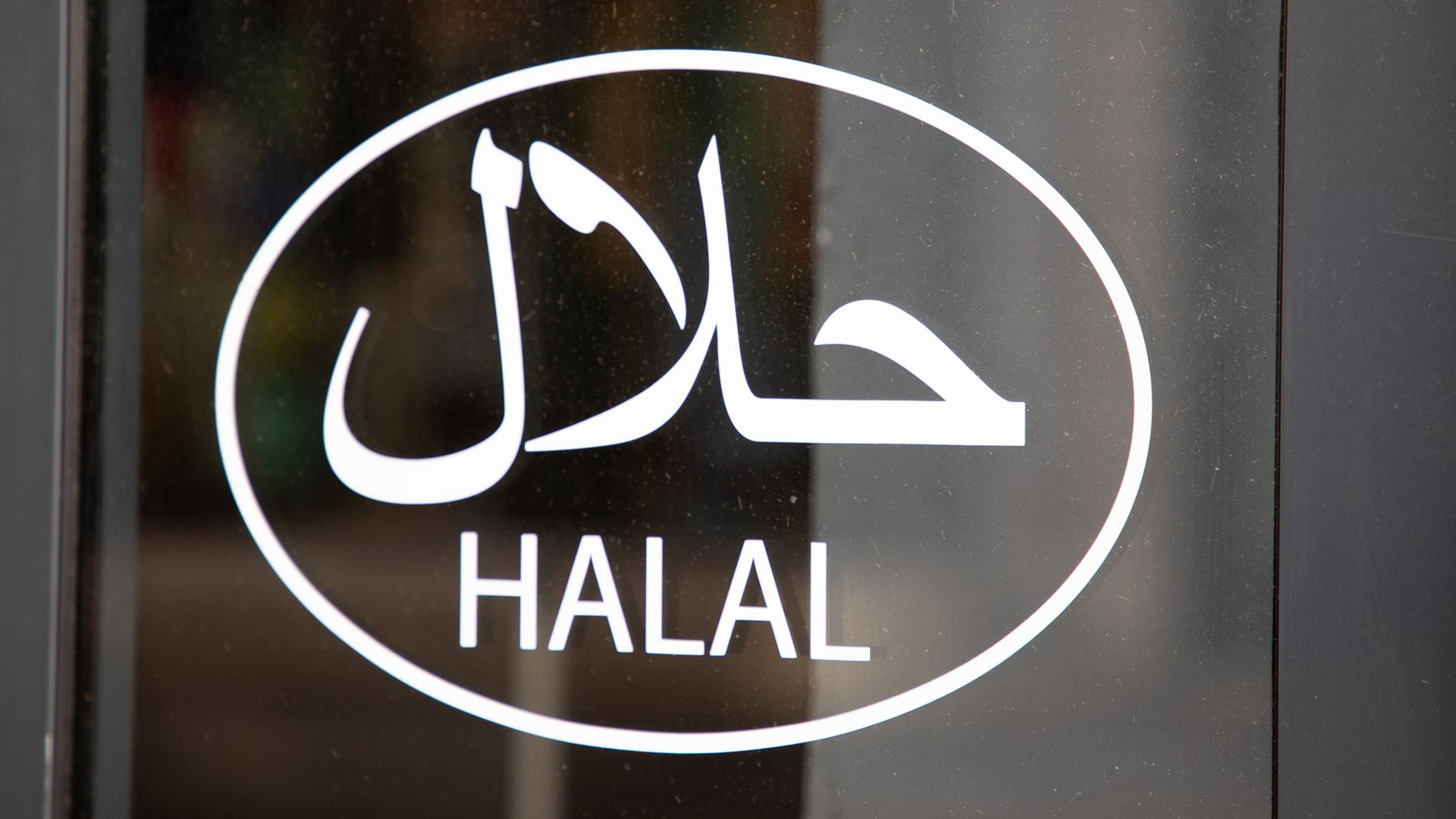 Ein weißes Halal-Symbol auf einer Fensterscheibe | IMAGO / Pond5 Images