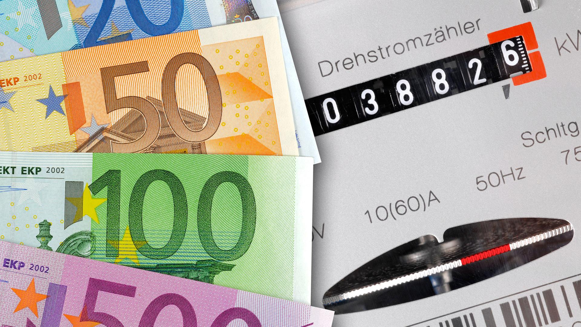 Geldscheine liegen neben einem Stromzähler | colourbox