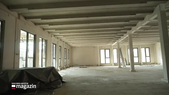 Ein Rohbau einer großen Bürofläche.