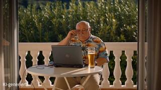 Ein KI-generierter Mann sitzt an einem Tisch vor einem Laptop