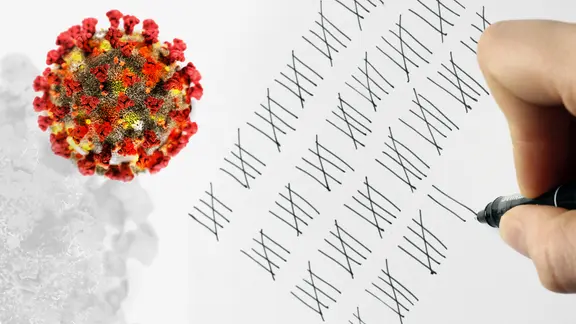 Jemand macht eine Strichliste neben der Abbildung von Viren.