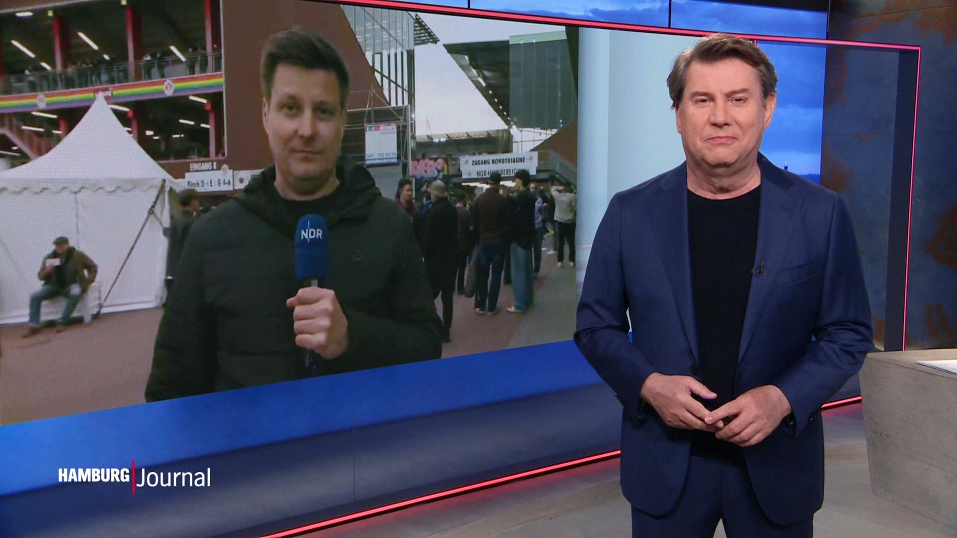 Jens Riewa im Interview mit einem Journalisten vor dem Millerntor. | Screenshot