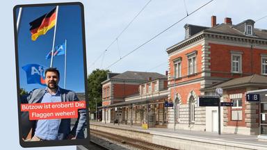 Der Bahnhof von Bützow und ein Post der AfD.